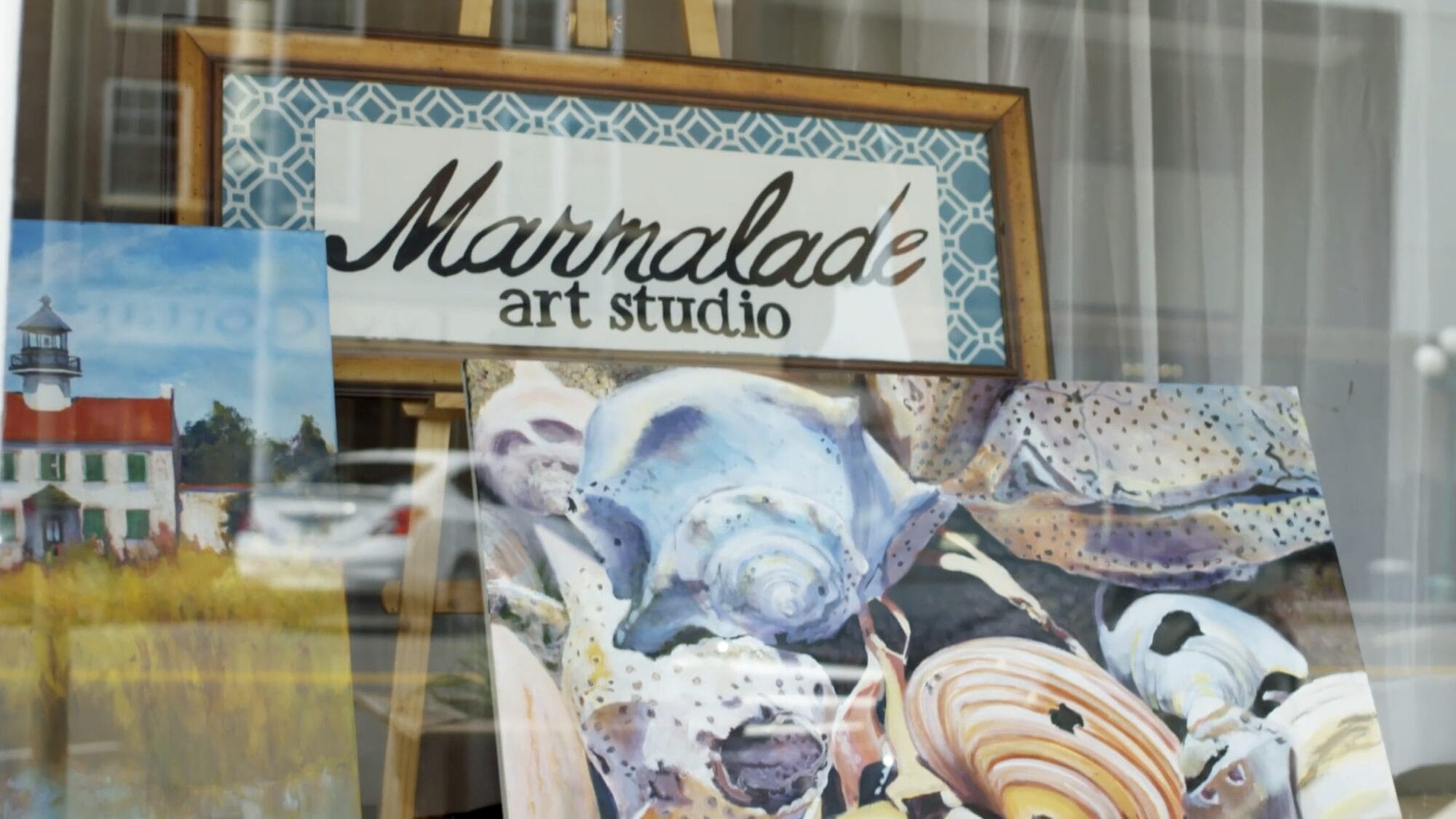 Original art work on display in the front window of Marmalade Art Studio in Gate City, Virginia.